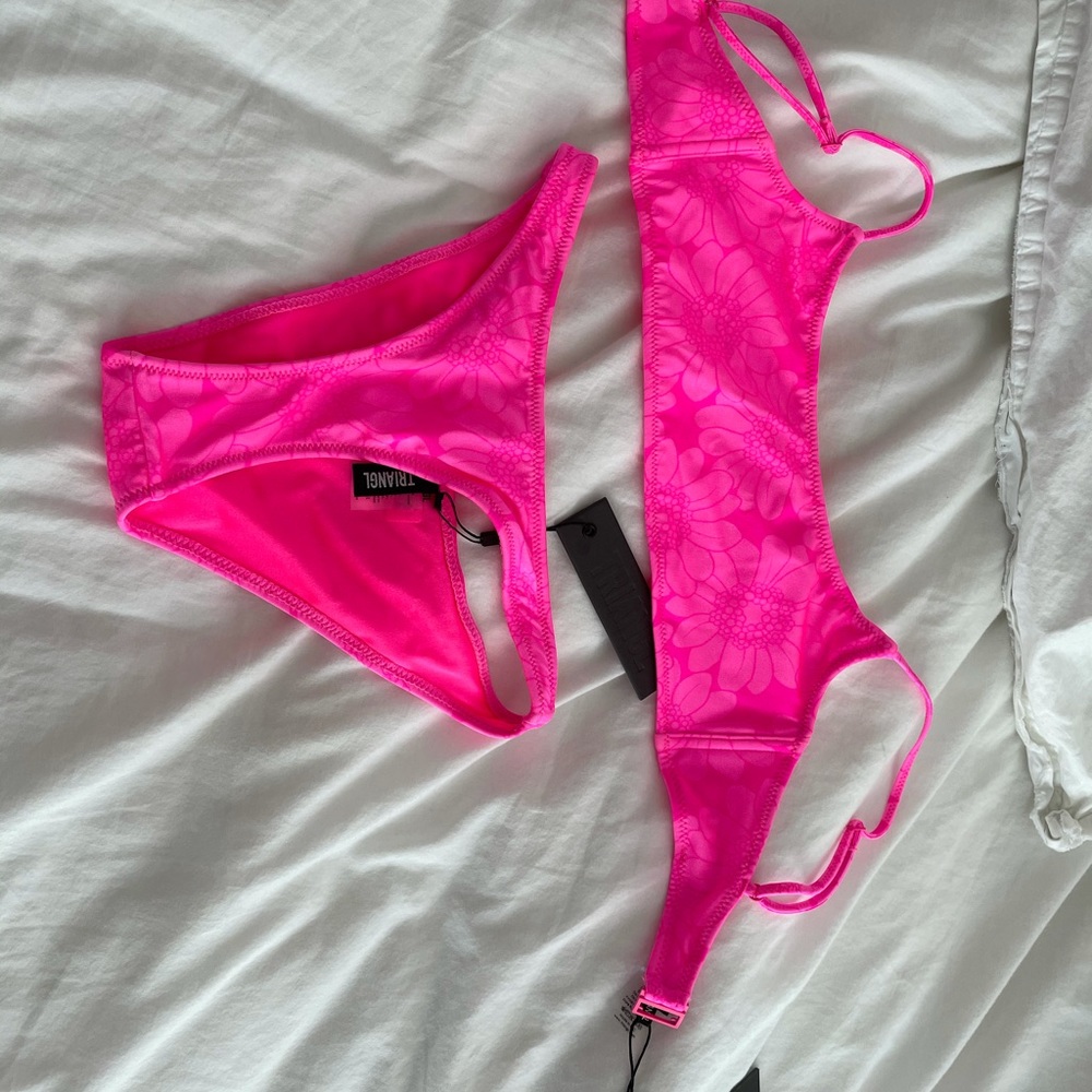 Never worn triangl suit